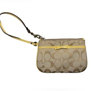 Authentic Bow Coach Wristlet Pastel Yellow 🌼